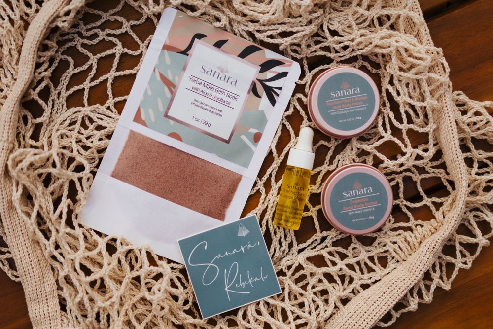 Organic skincare products nestled in a natural woven net bag.