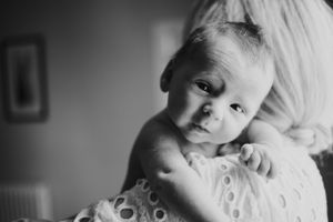Extreme close-up of baby's features showing delicate skin texture and nose.