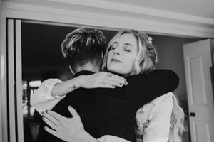 An emotional embrace captured in black and white photography.