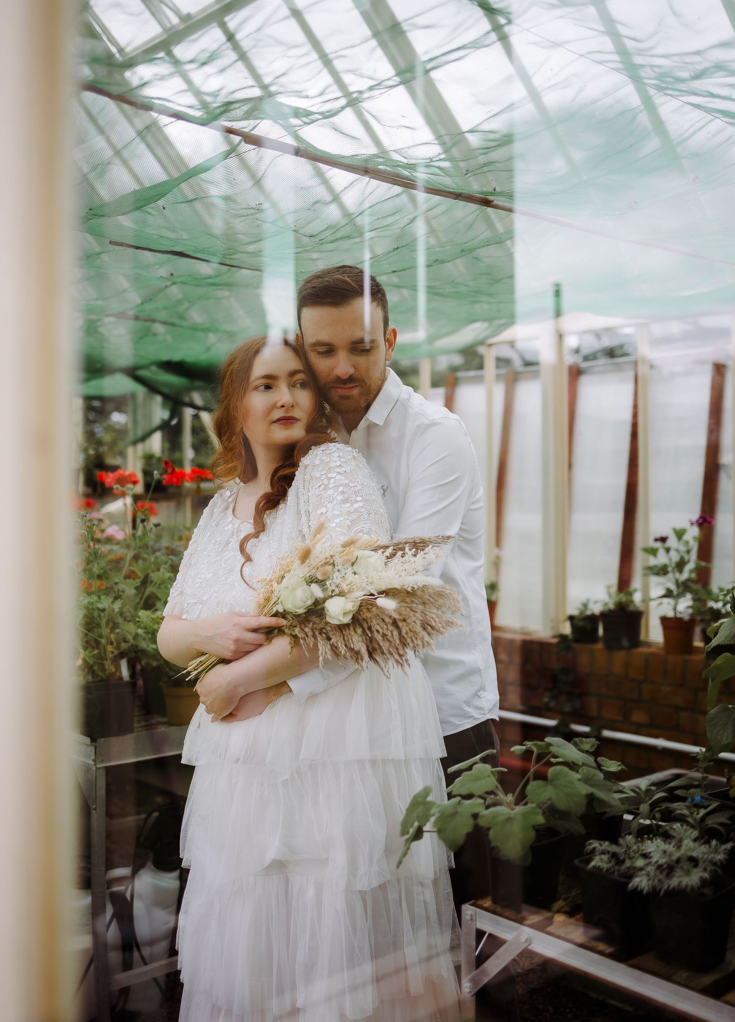 Couple portrait in the green house Cumbria wedding photographer