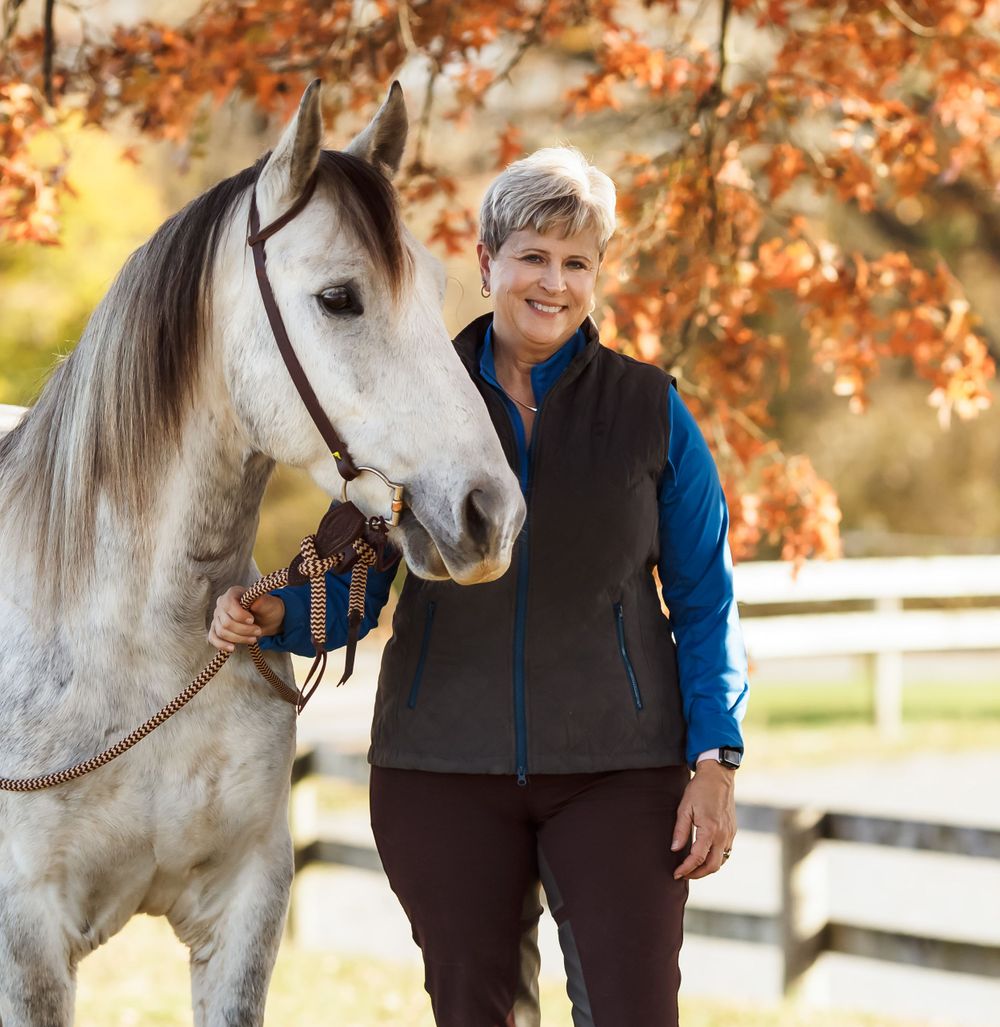 woman with gray horse