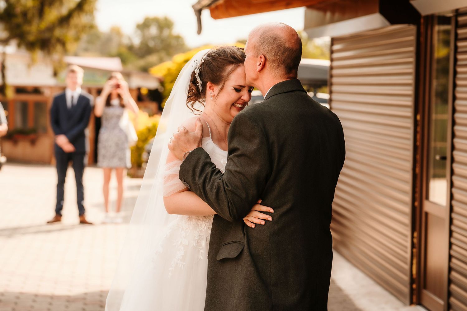 An intimate wedding moment shared between a couple during their outdoor ceremony.