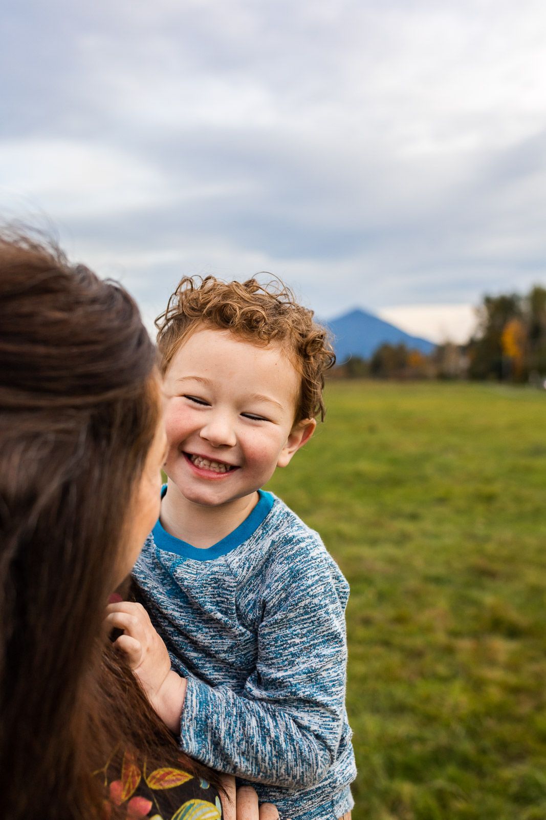 Mother son laughing together by Mt. Si.