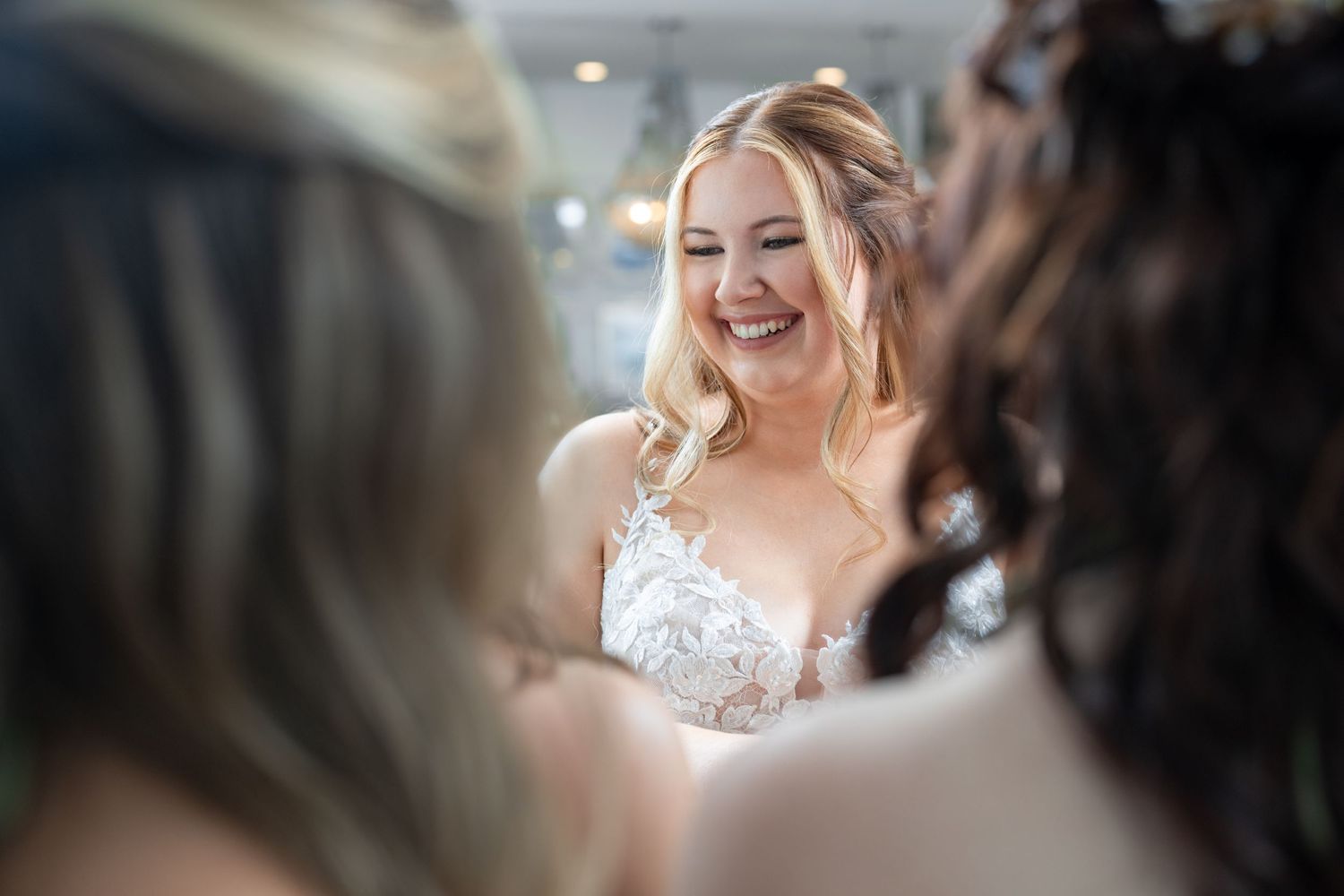 A joyful moment captured as the bride shares laughter with wedding guests.