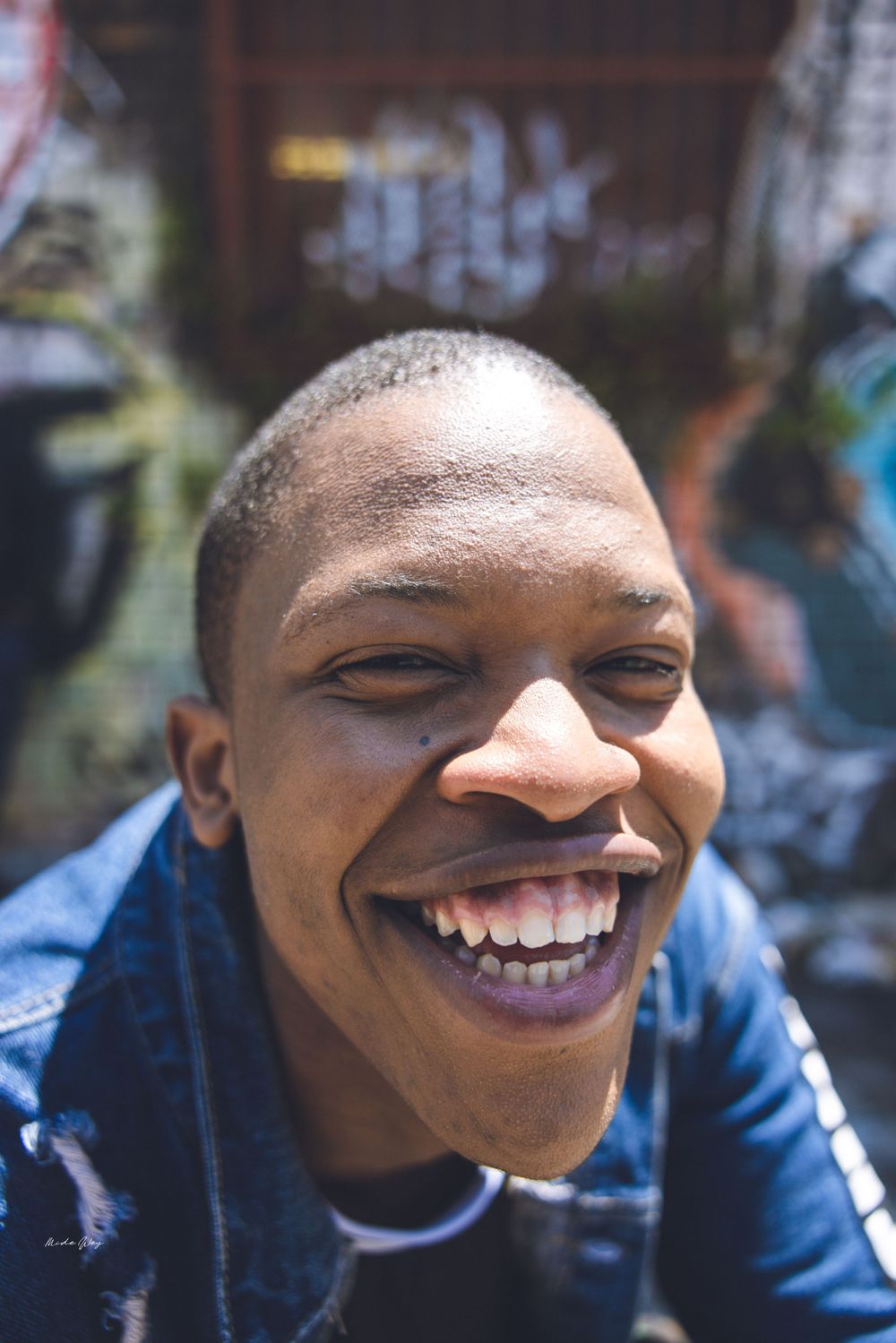 A series of progressive shots showing increasing joy while wearing denim.