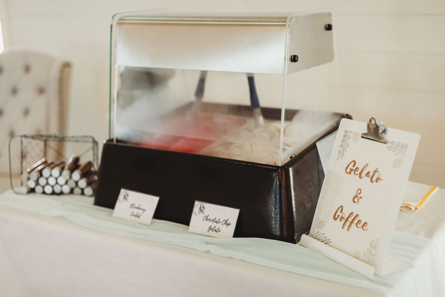 Vintage record player display setup with 'drinks & coffee' sign at wedding reception.