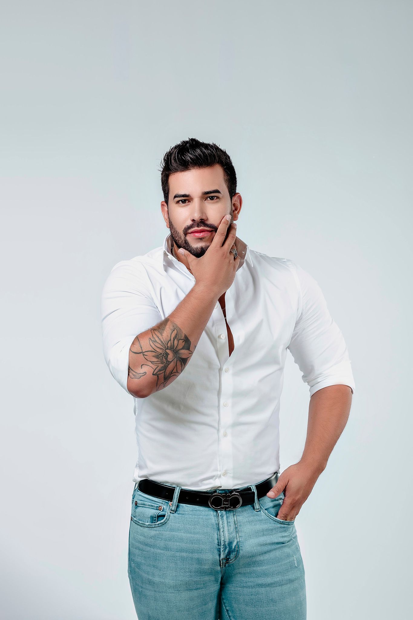 Model in white button-down shirt and jeans shows different casual poses.