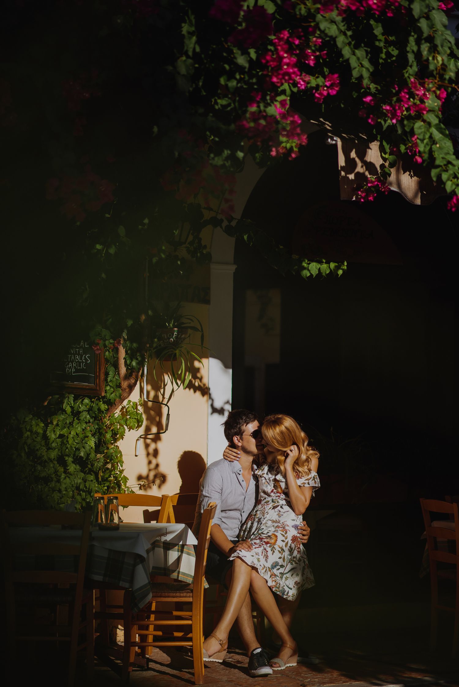 Garden setting with pink bougainvillea flowers creating a romantic atmosphere at dusk.
