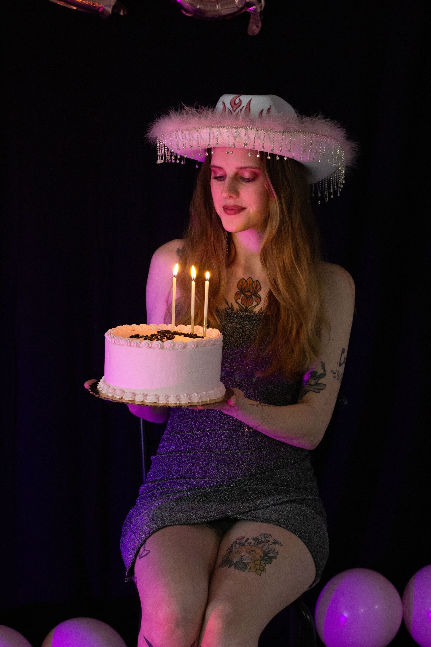 A girl celebrating her birthday with a cowboy hat