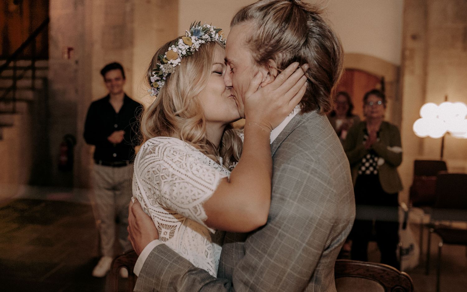 An intimate moment between newlyweds sharing a romantic kiss.