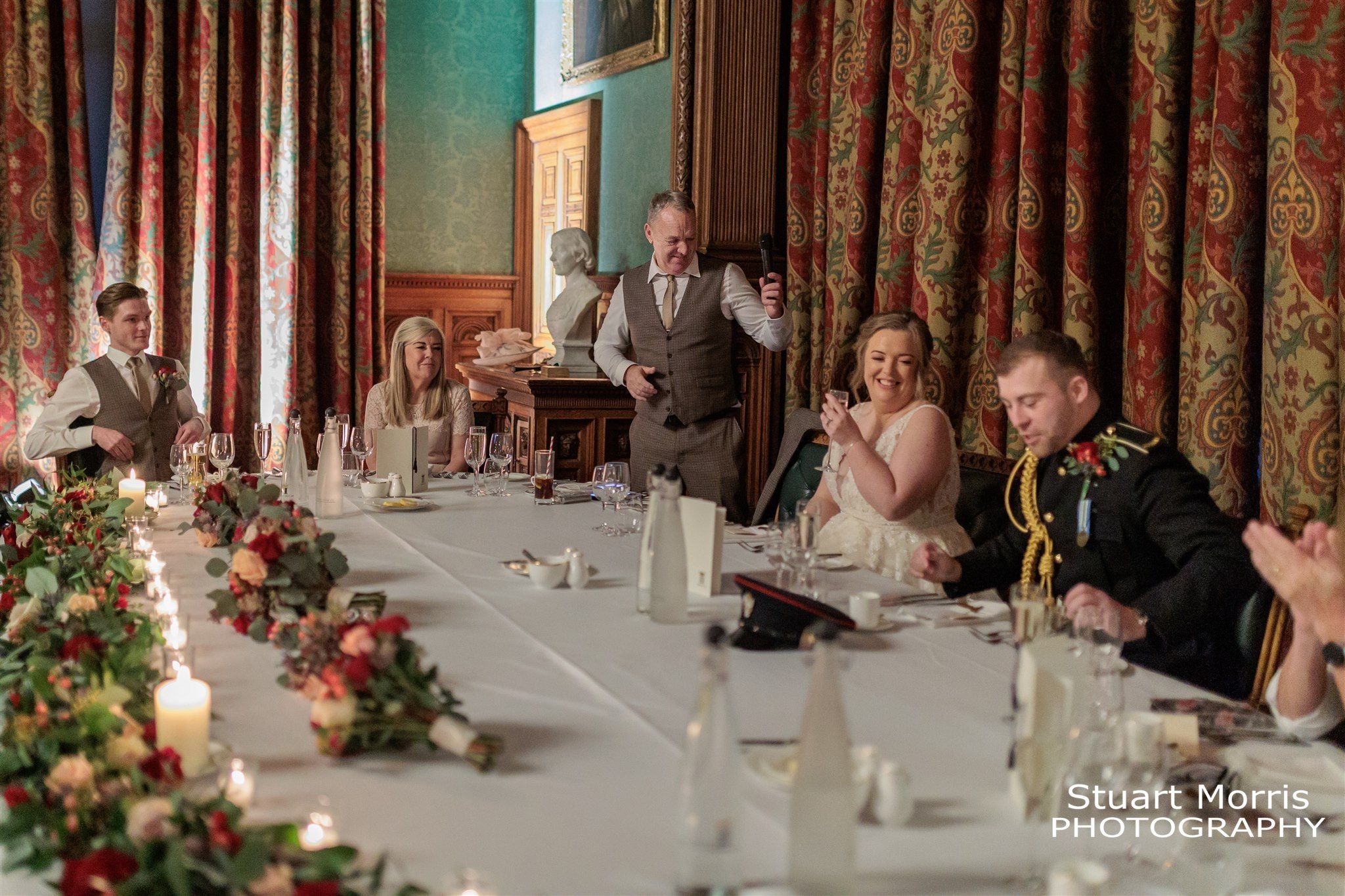 The top table during the father of the brides speech at Knowsley hall Liverpool wedding venue.