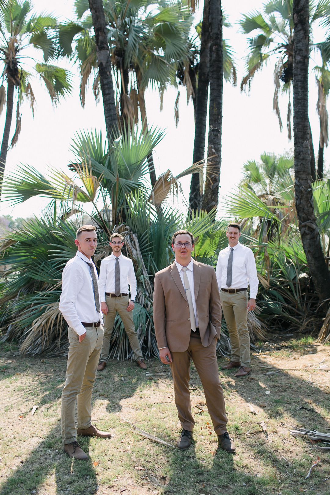 A groom and his groomsmen showing off thier safari wedding style.