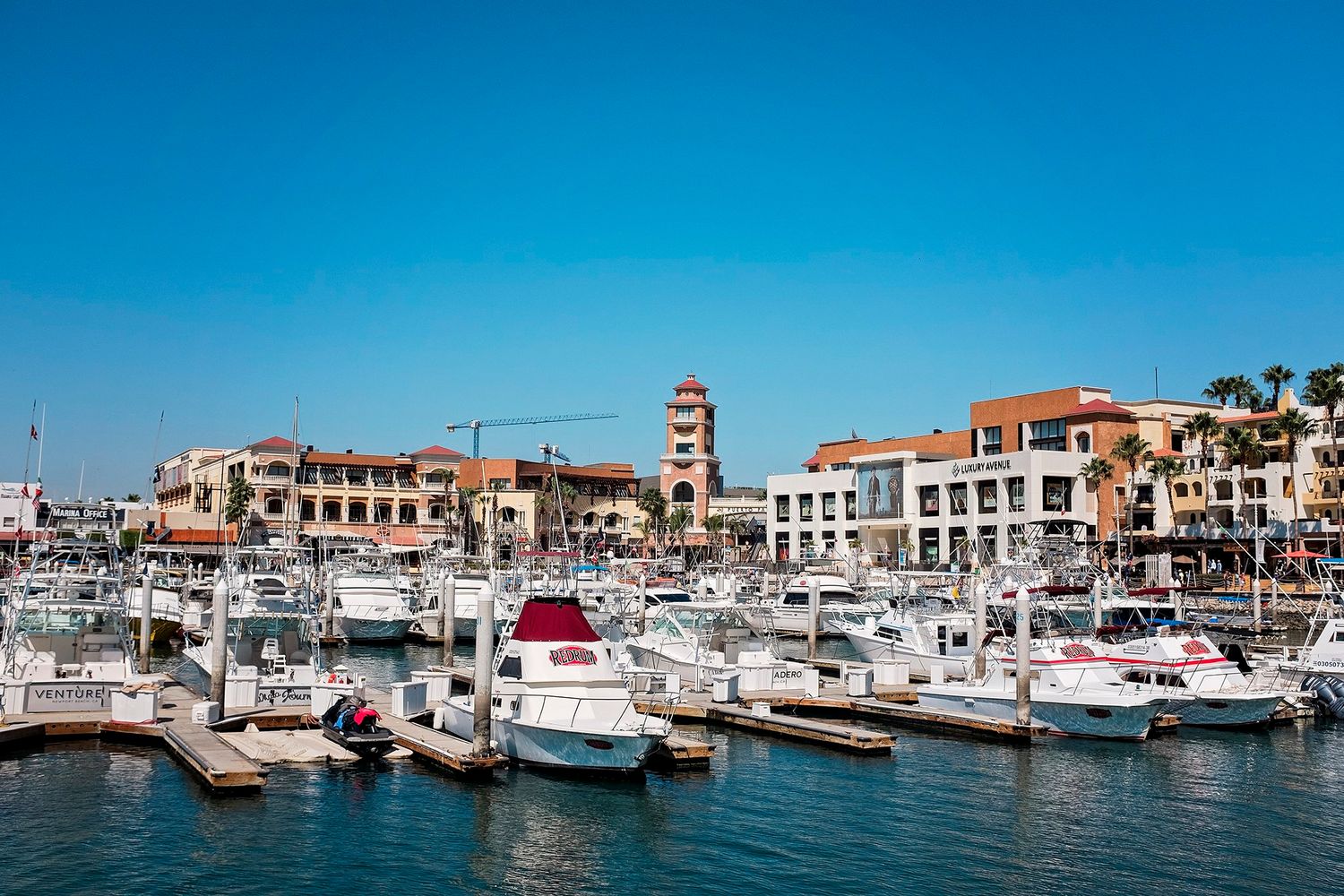 Many boats docked at the marina.