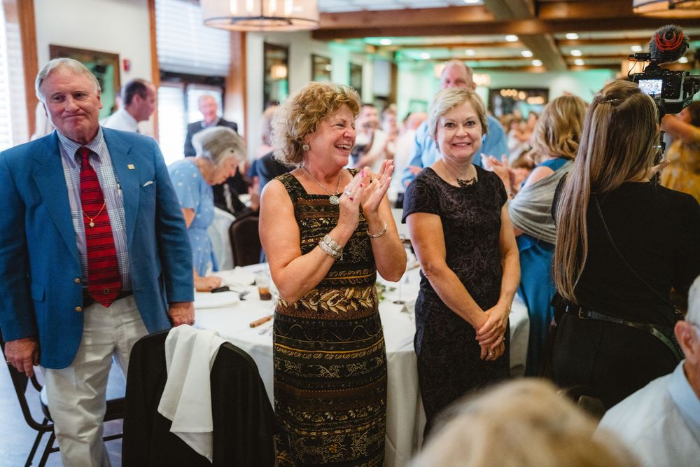 Guests enjoying a lively moment during a wedding reception.