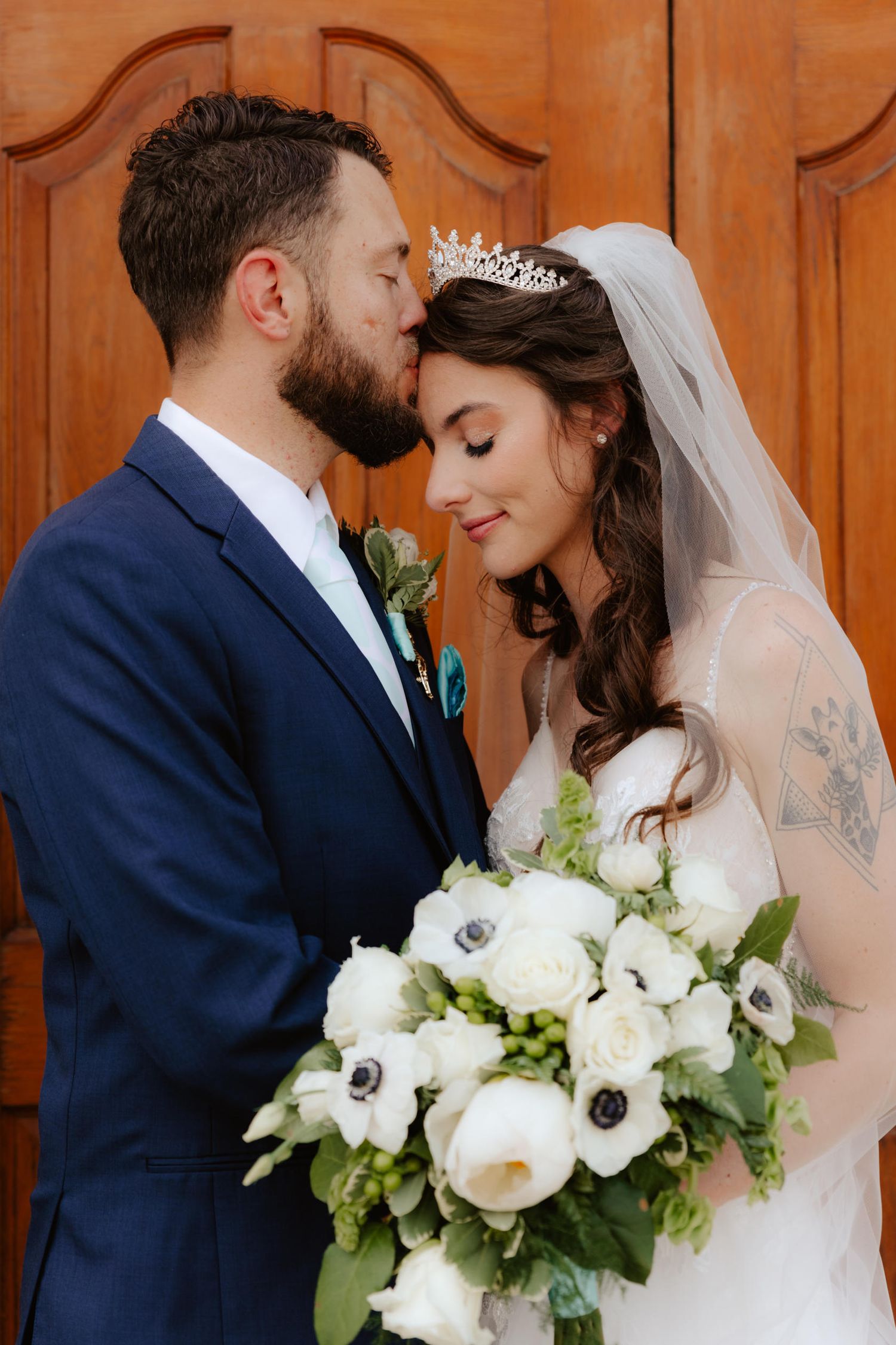 bride groom wedding bouquet pose wedding dress veil