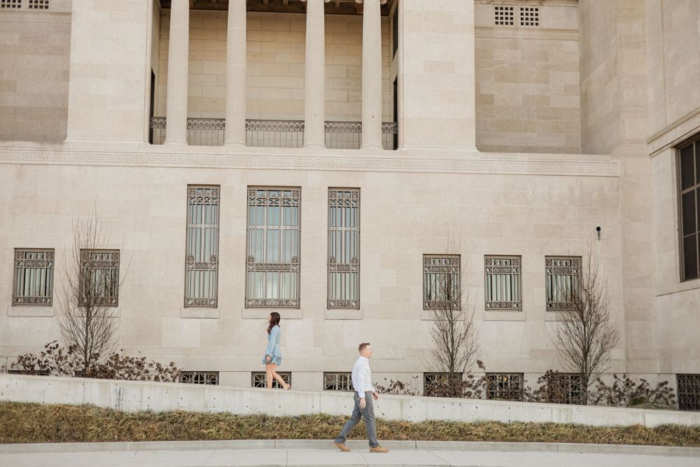 Architectural view of a grand stone building with classical columns and windows.