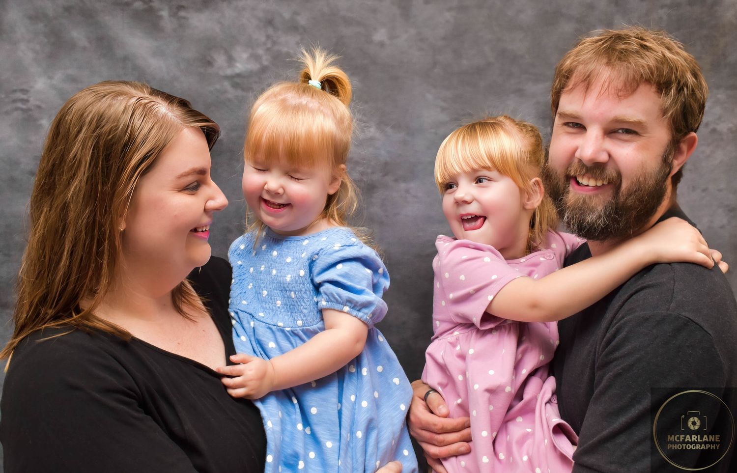 Portrait series with relaxed interactions against gray studio background.