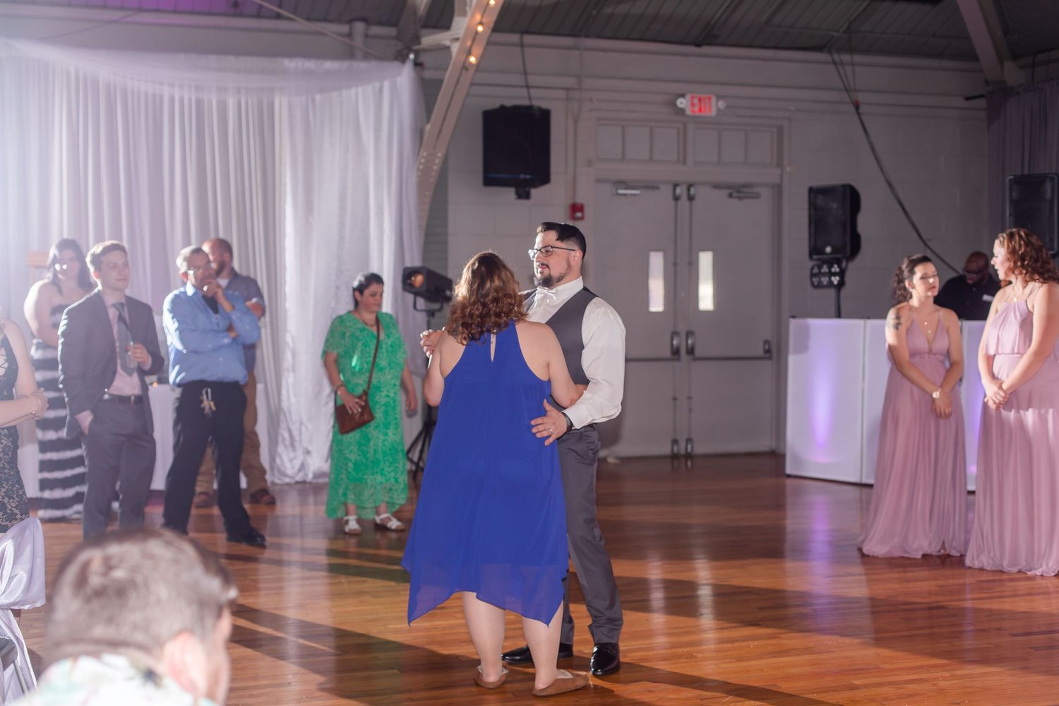 Wedding reception dance floor with guests enjoying the celebration.