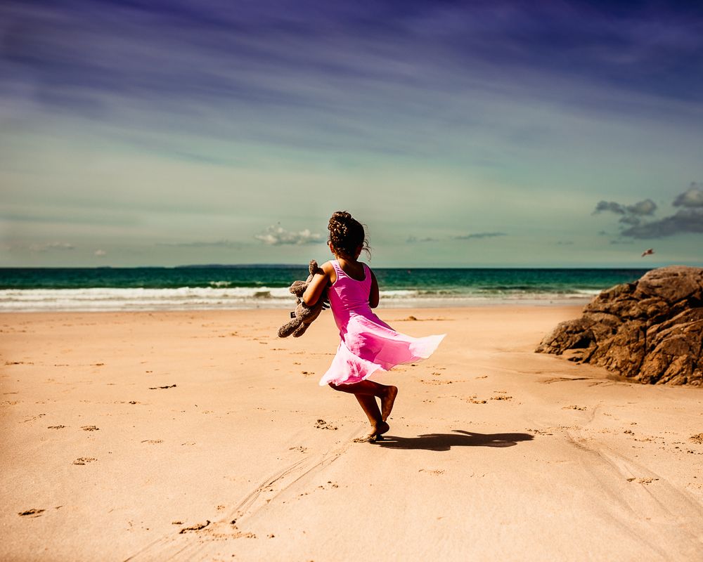 Jersey CI photographer little barelina twirling in Plemont beach