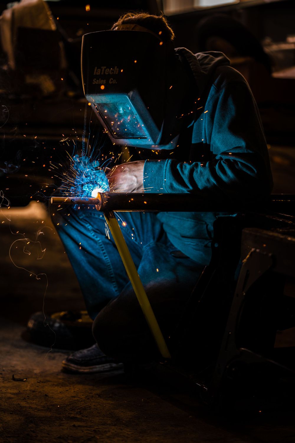 Iowa welder welding on steel tube.