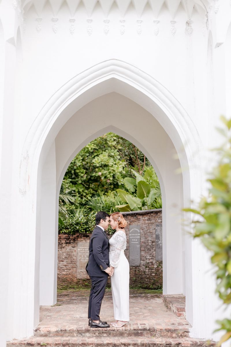 Wedding couple posing at Fort Canning after their ROM solemnisation at the Registry of Singapore.