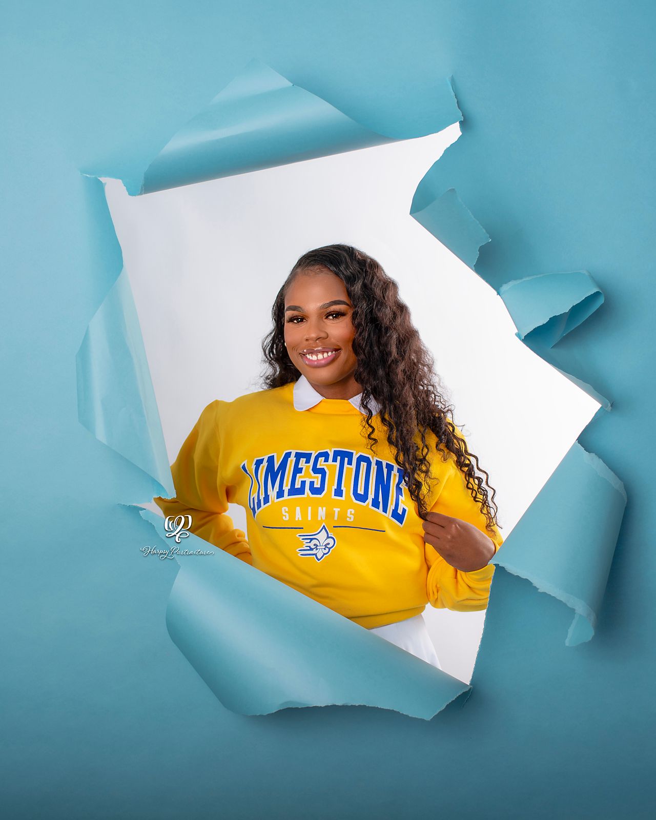 Senior posing in torn paper photoshoot; Lexington, SC portrait studio senior photography; high school pictures senior