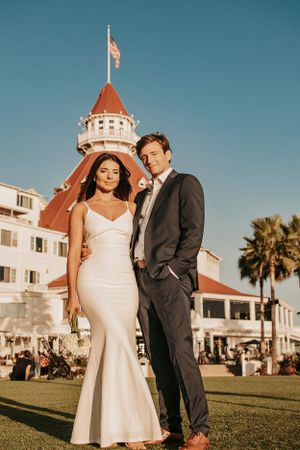 Elegant wedding portrait showcasing the Hotel del Coronado's historic Victorian architecture and turret.
