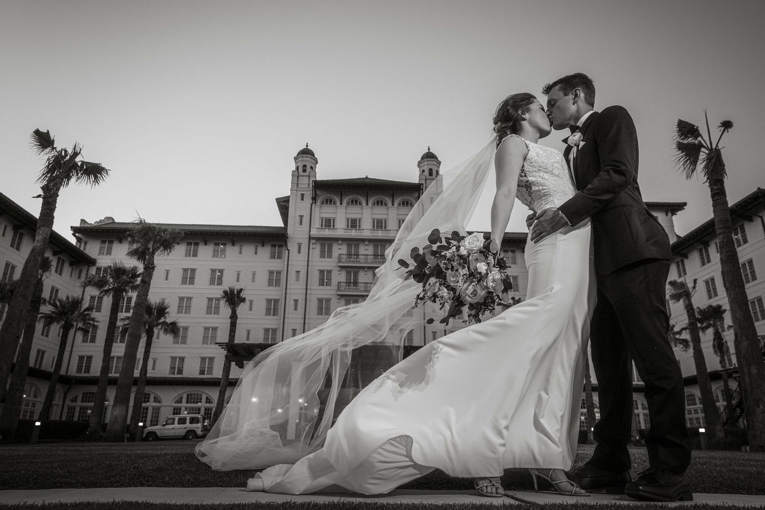 Artistic black and white wedding photography series against classic architecture backdrop.