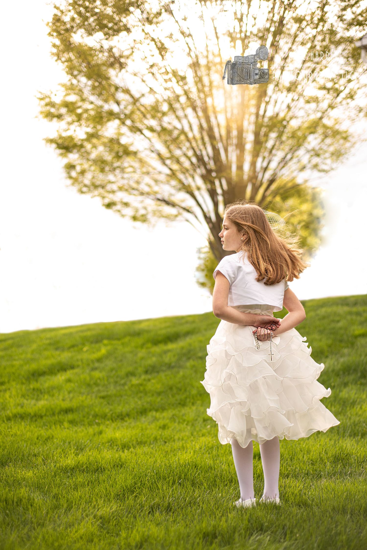 little girl in Communion dress with rosary