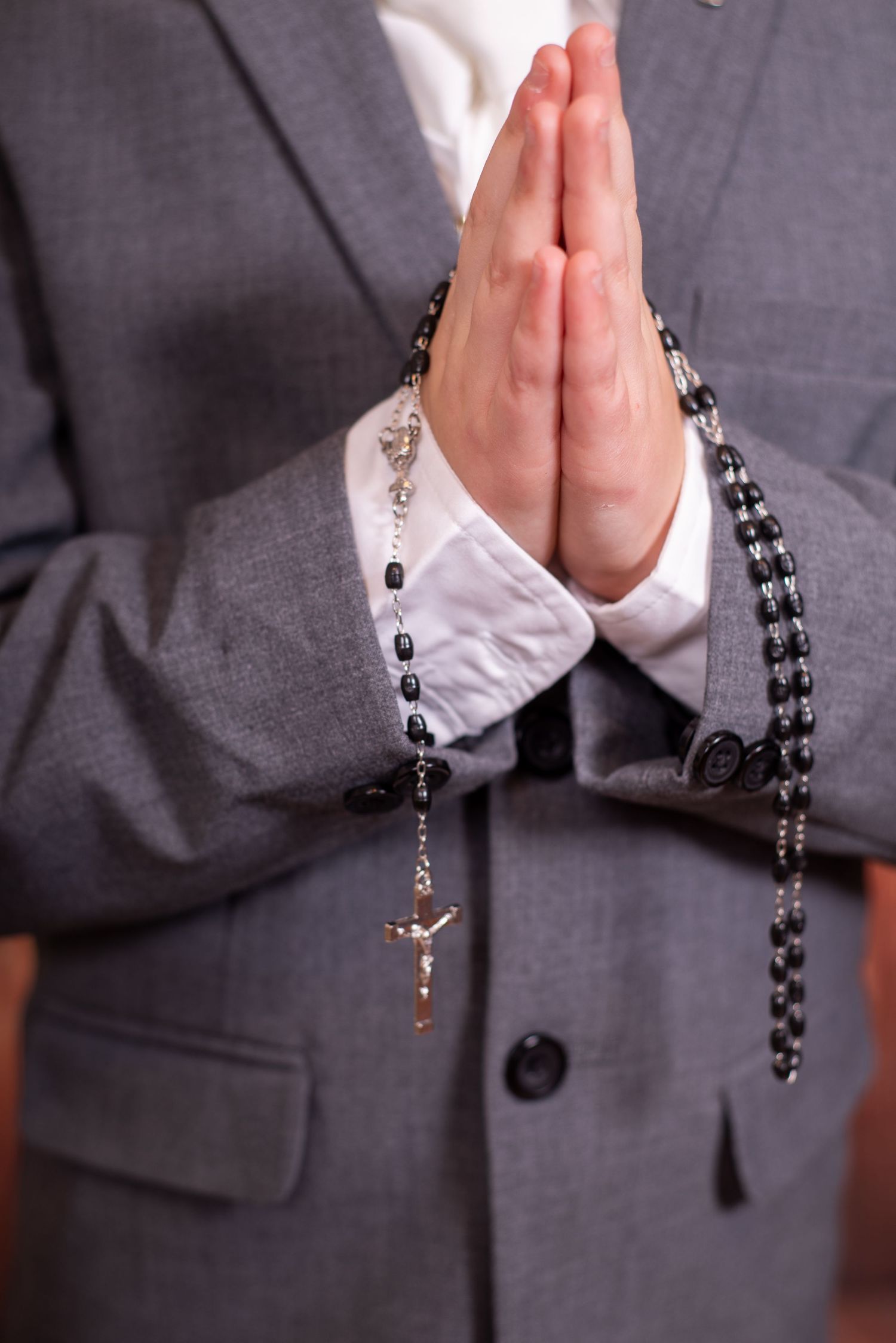 Prayer hands with rosary