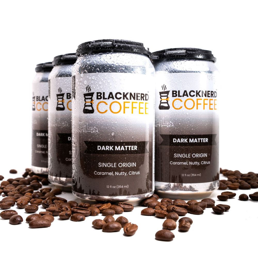 Row of Dark Matter canned coffee drinks from Blacknerd Coffee brand with scattered coffee beans.