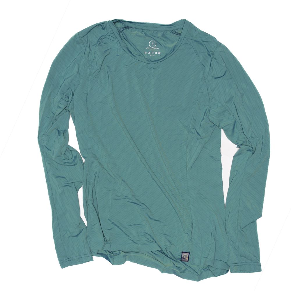 Teal long sleeve t-shirt laid flat against white background.