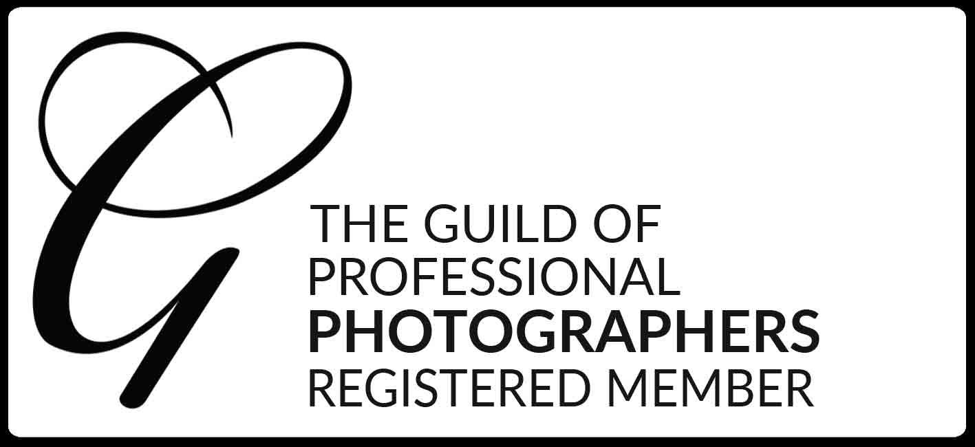 Black and white logo for The Guild of Professional Photographers showing text and a stylized 'G' design element.