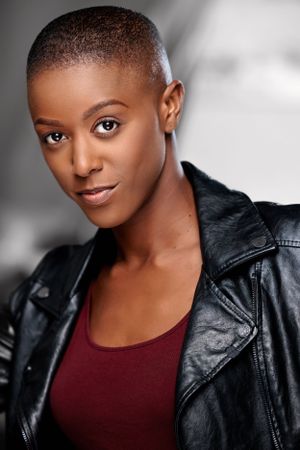 Headshot of a beautiful black woman, shaved head , actor headshot, atlanta actor headshot