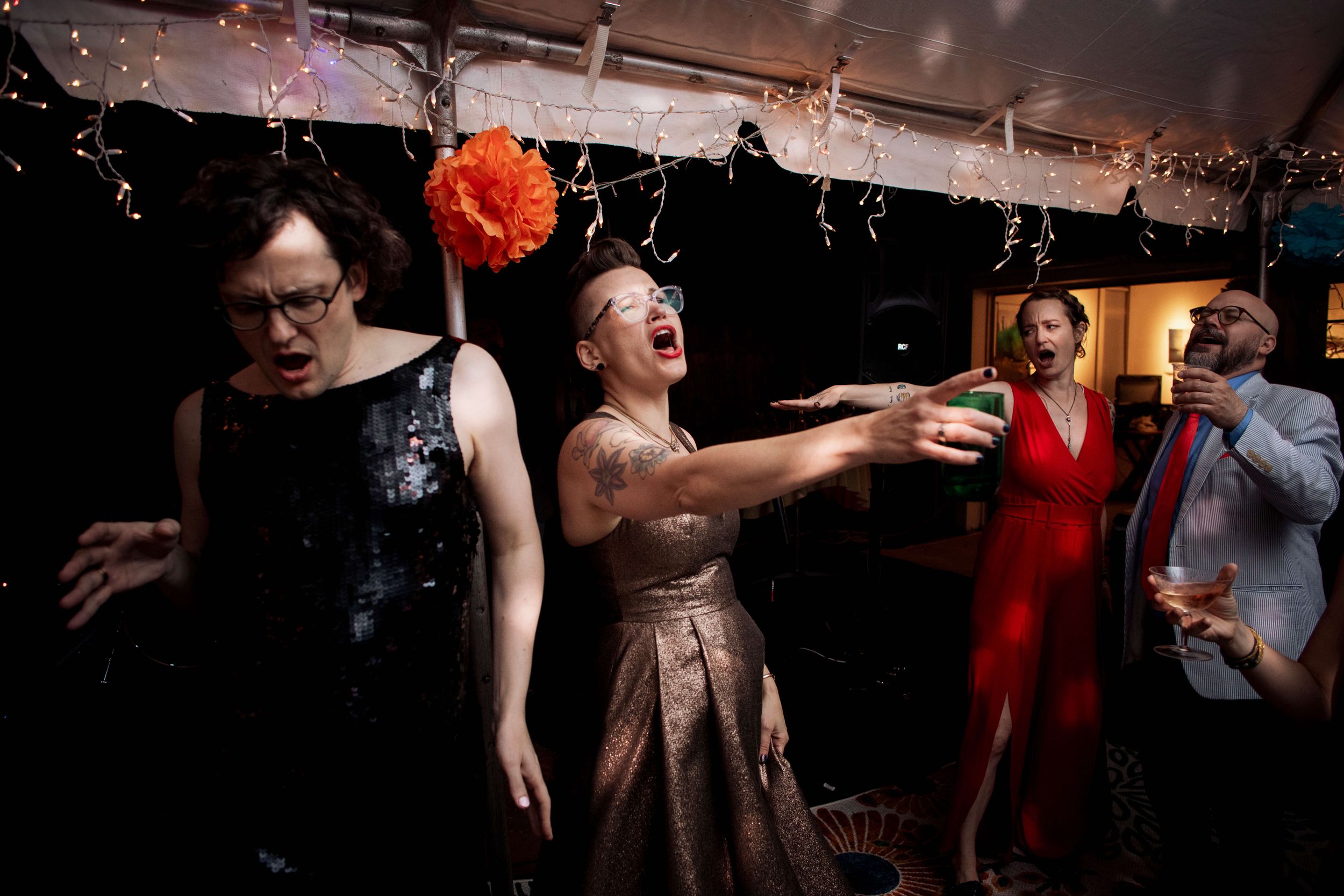 Wedding couple rock out to the Silver Arrow Band at their DIY backyard Love Celebration in Bayport NY.