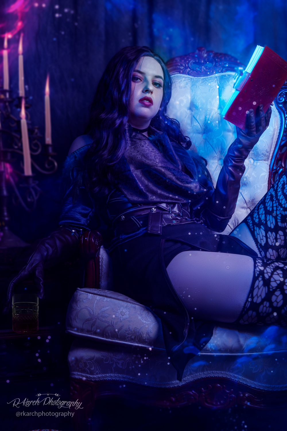 Mystical portrait with neon lighting and candles in gothic setting.