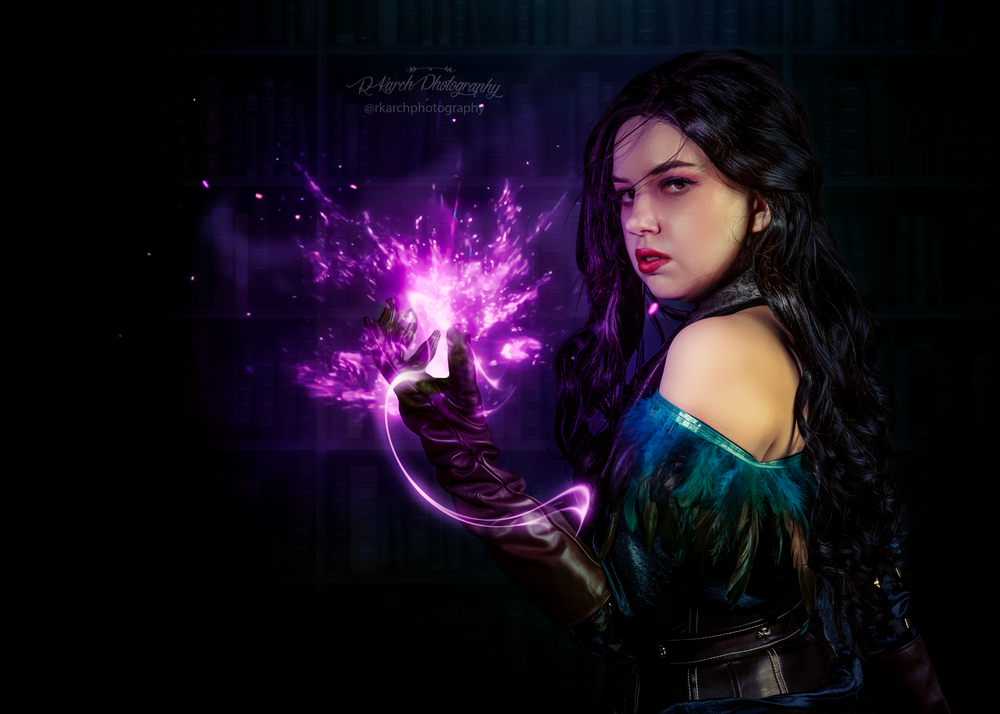 Magical portrait featuring purple energy effects and gothic fantasy costume against dark background.