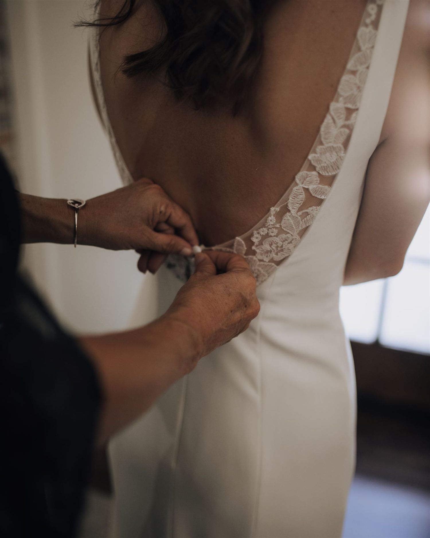 bride and bridesmaids getting ready in suite of Carriage House wedding venue in Conroe, Tx