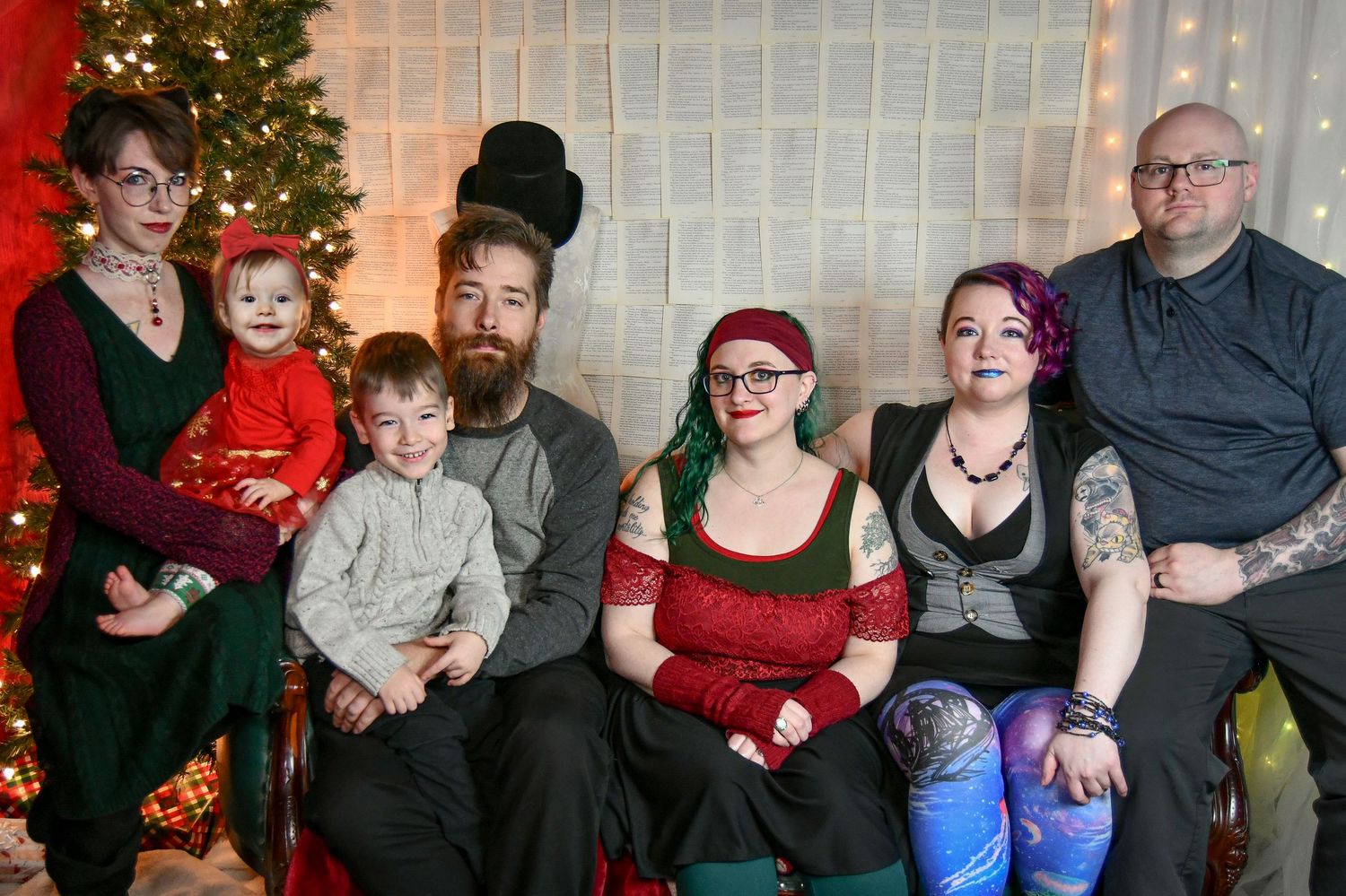Polyamorous family holiday photo with Adams family and their partners.
