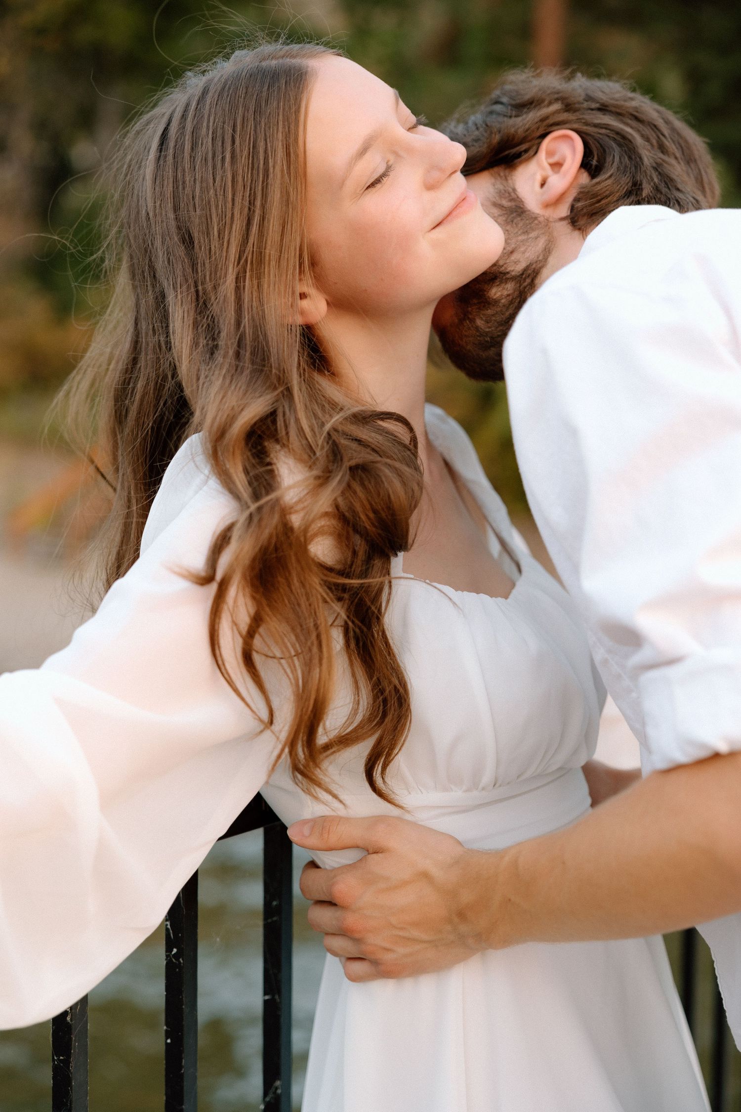 Bride and groom exchange vows in a lush outdoor garden in the Okanagan Valley