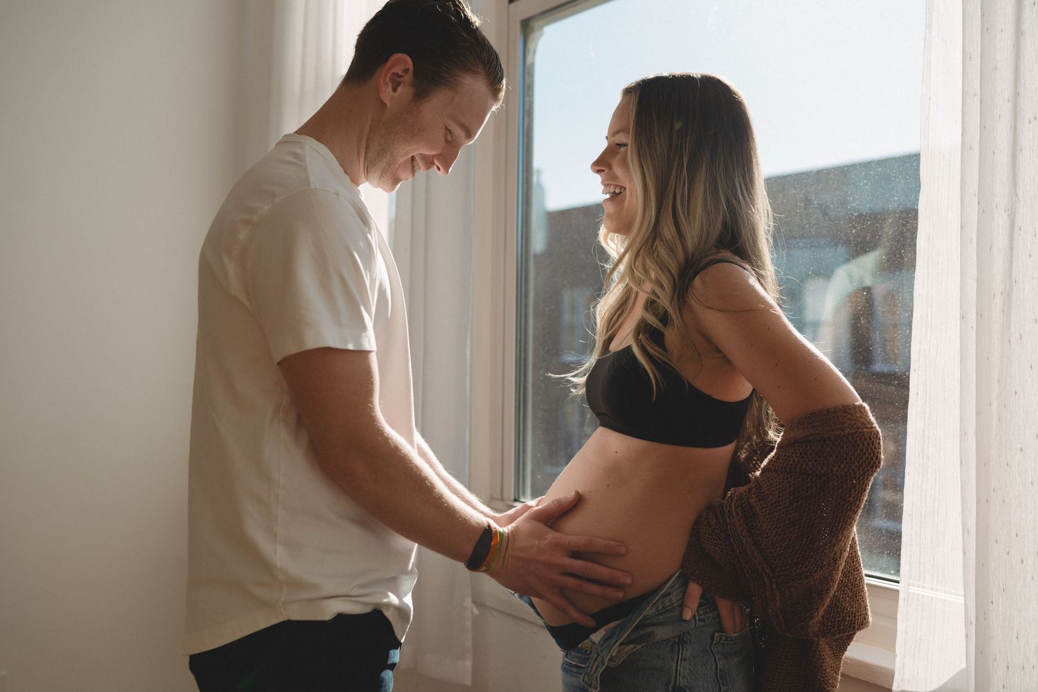 chicago studio session in wicker park of a maternity couple expecting their first child. Couple maternity pose.