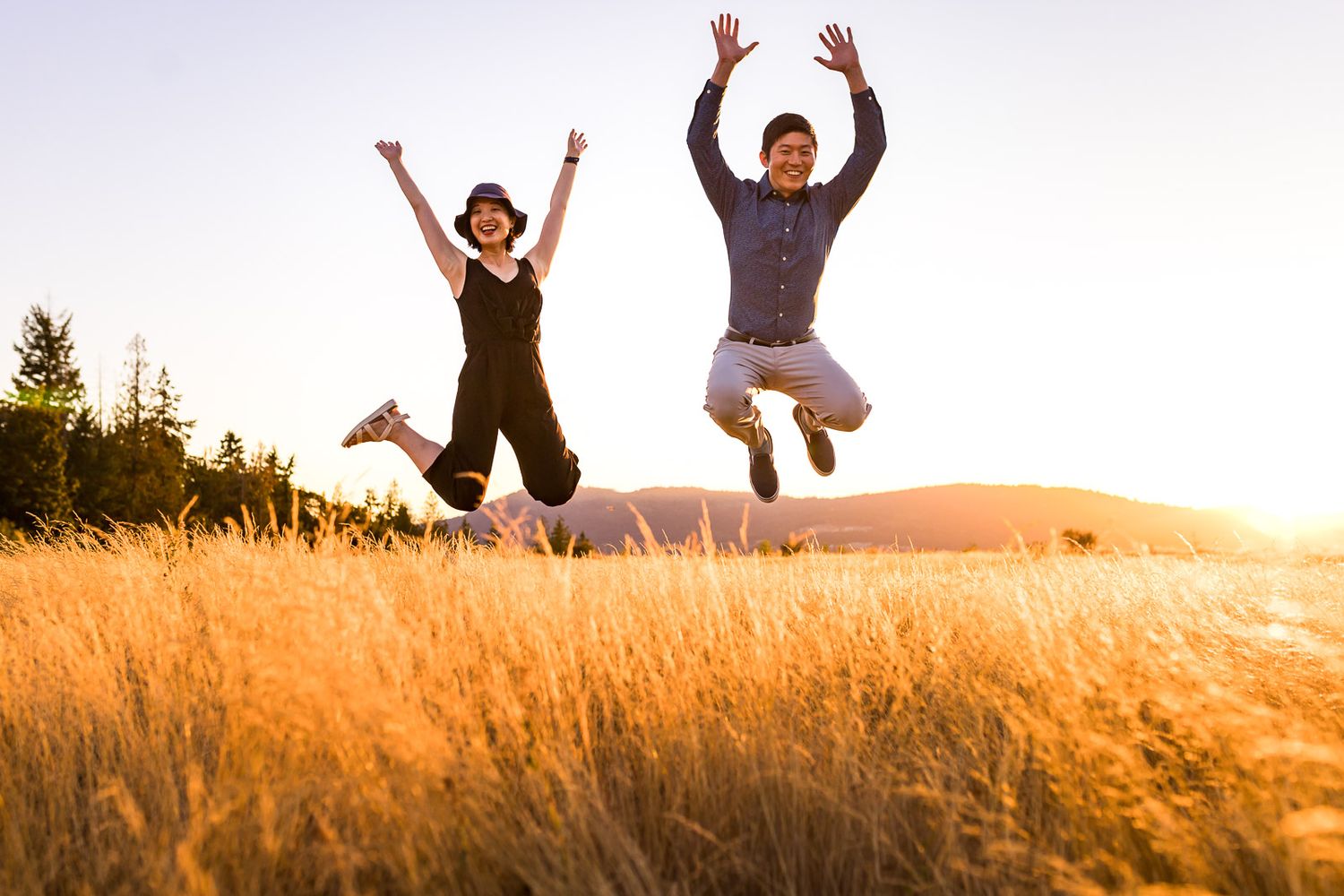 Brother sister do a jumping shot at Issaquah Highlands by Redmond Family Photographer