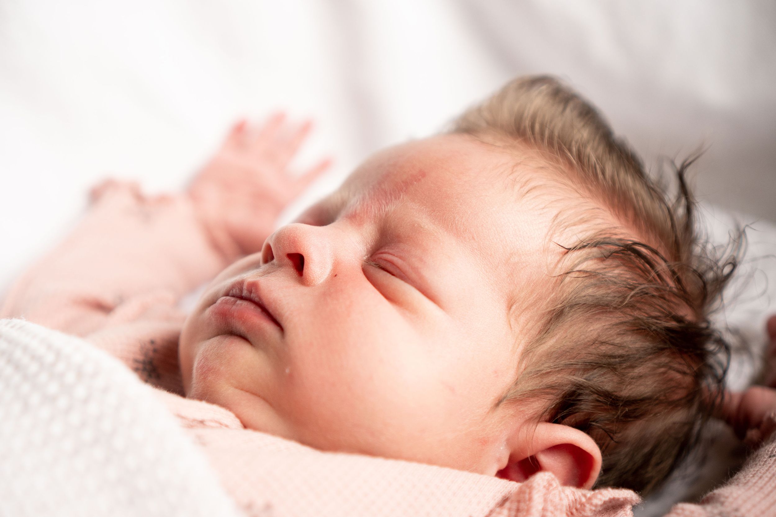Close up photograph of sleeping newborn baby