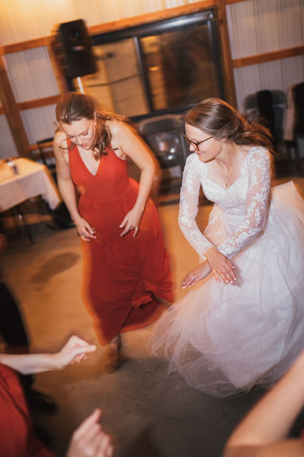 Dance floor action shots capture the bride and guests spinning in their formal attire.
