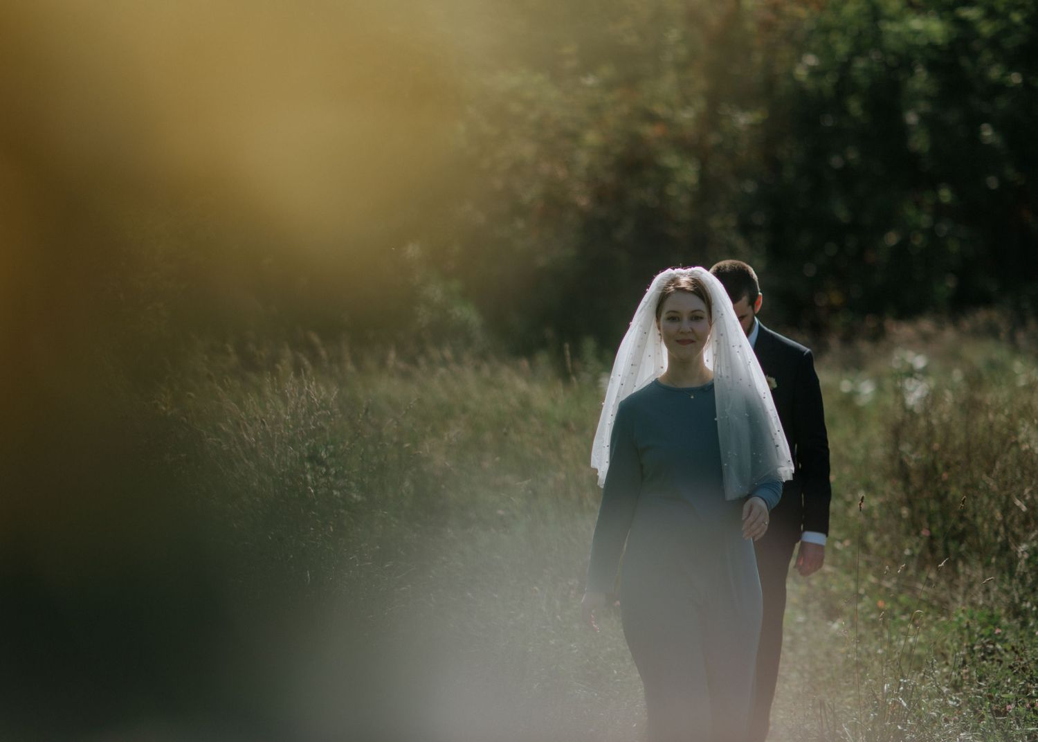 Blurred artistic wedding photo sequence in natural outdoor setting.