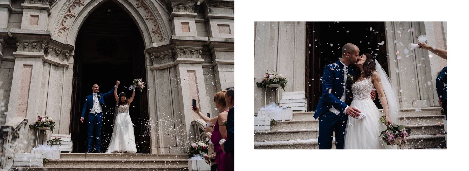 Newlyweds emerge from an ornate church entrance as guests shower them with confetti in celebration.