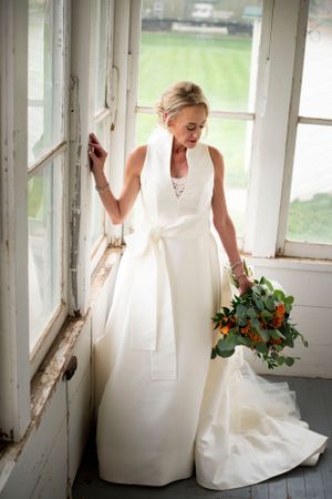 White wedding dress details shown in a series of sunlit window frames.