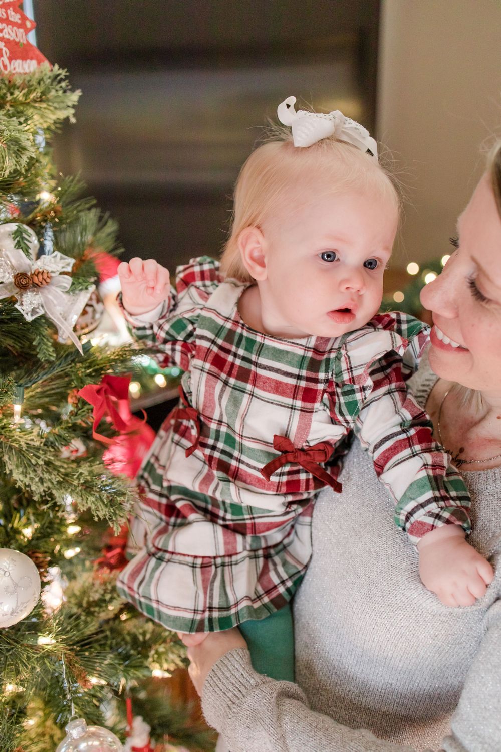 mom and baby by the christmas tree