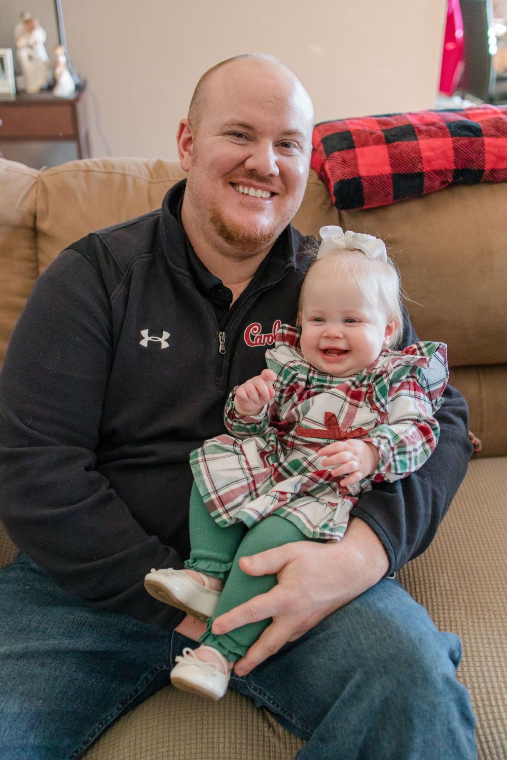 Dad and baby sitting on the couch