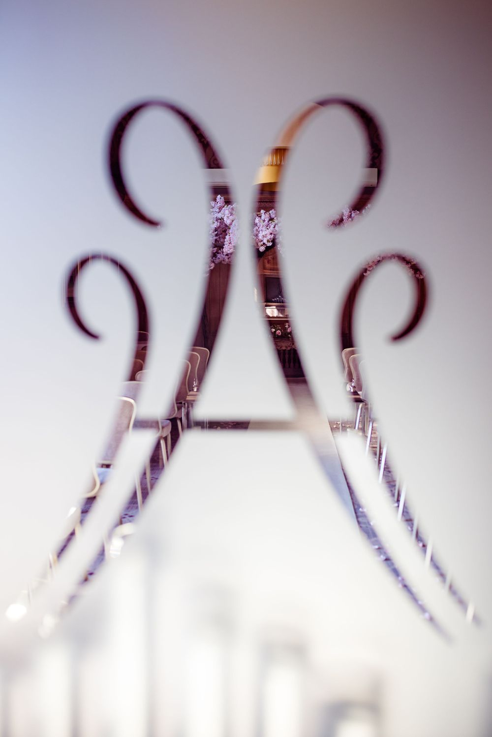 Artistic blurred shot of decorative metal scrollwork in soft focus.